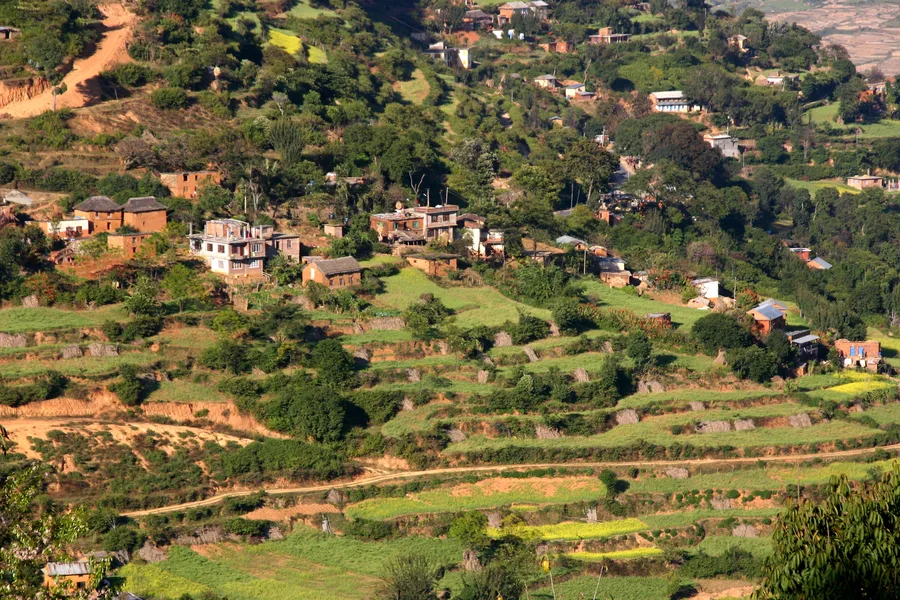 Terraced hillside farmland and village houses in the Chobhar area near Kathmandu, Nepal.