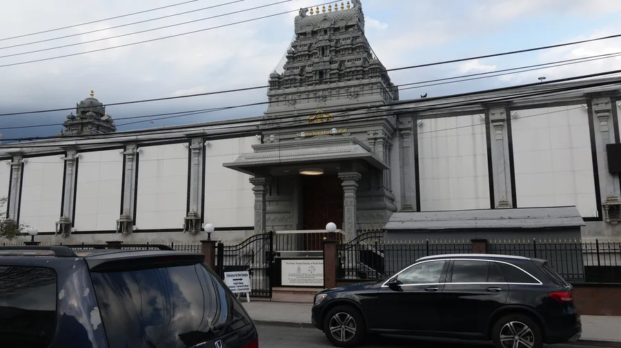 The stone gopuram entrance of the Hindu Temple Society of North America in Flushing, Queens.