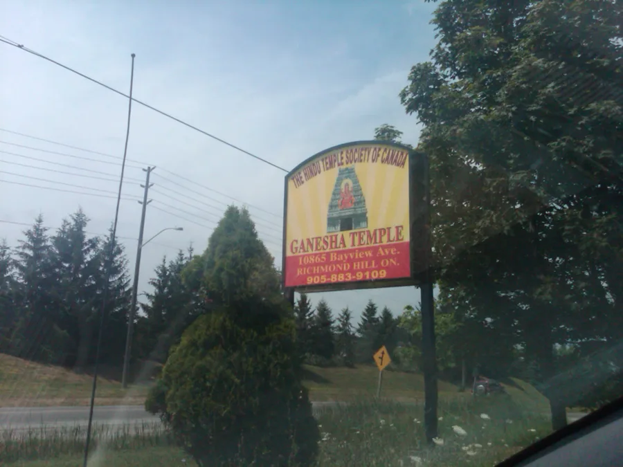 A roadside sign for the Ganesha Temple of the Hindu Temple Society of Canada in Richmond Hill, Ontario.