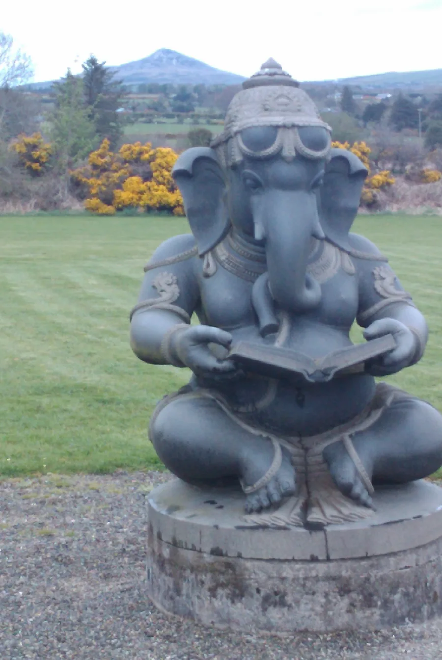A black granite statue of Ganesha at Victor's Way sculpture garden in County Wicklow, Ireland.