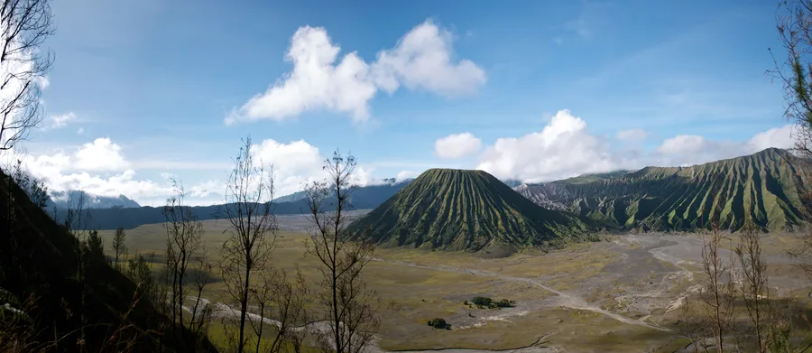 A wide panoramic view of Mount Bromo's volcanic caldera in East Java, Indonesia.