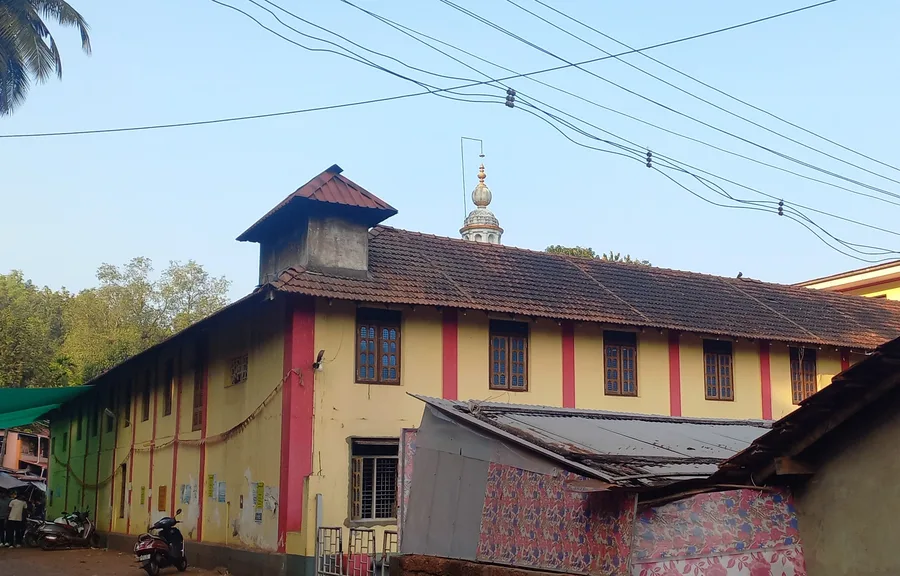 The yellow temple building and ornamental spire of the Ganesha Temple at Idagunji, Karnataka.