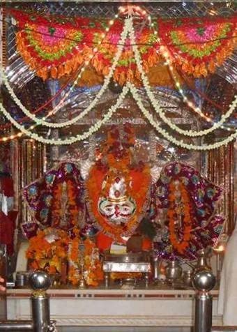 The garlanded Trinetra Ganesh idol at Ranthambore Fort, where devotees send their first wedding invitations.